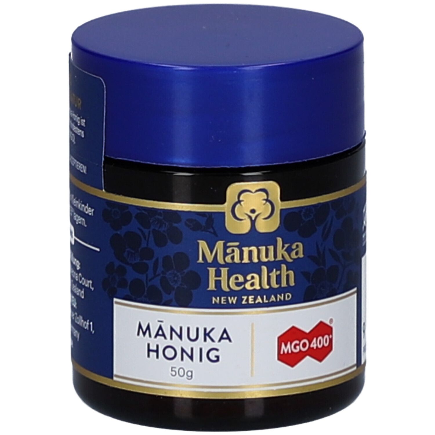 Braunes Glas mit blauem Deckel. Aufschrift: Mānuka Health, MGO 400+, Mānuka Honig, 50g. Logo: Blüte.