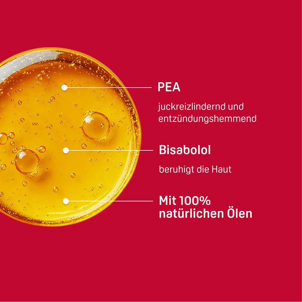 Inhaltsstoffe: PEA, Bisabolol, 100% natürliche Öle. Nahaufnahme von gelber Flüssigkeit mit Blasen.