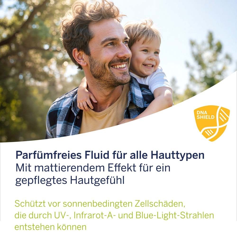Mann mit Kind im Freien. Text: Parfümfreies Fluid für alle Hauttypen. DNA Shield Logo.