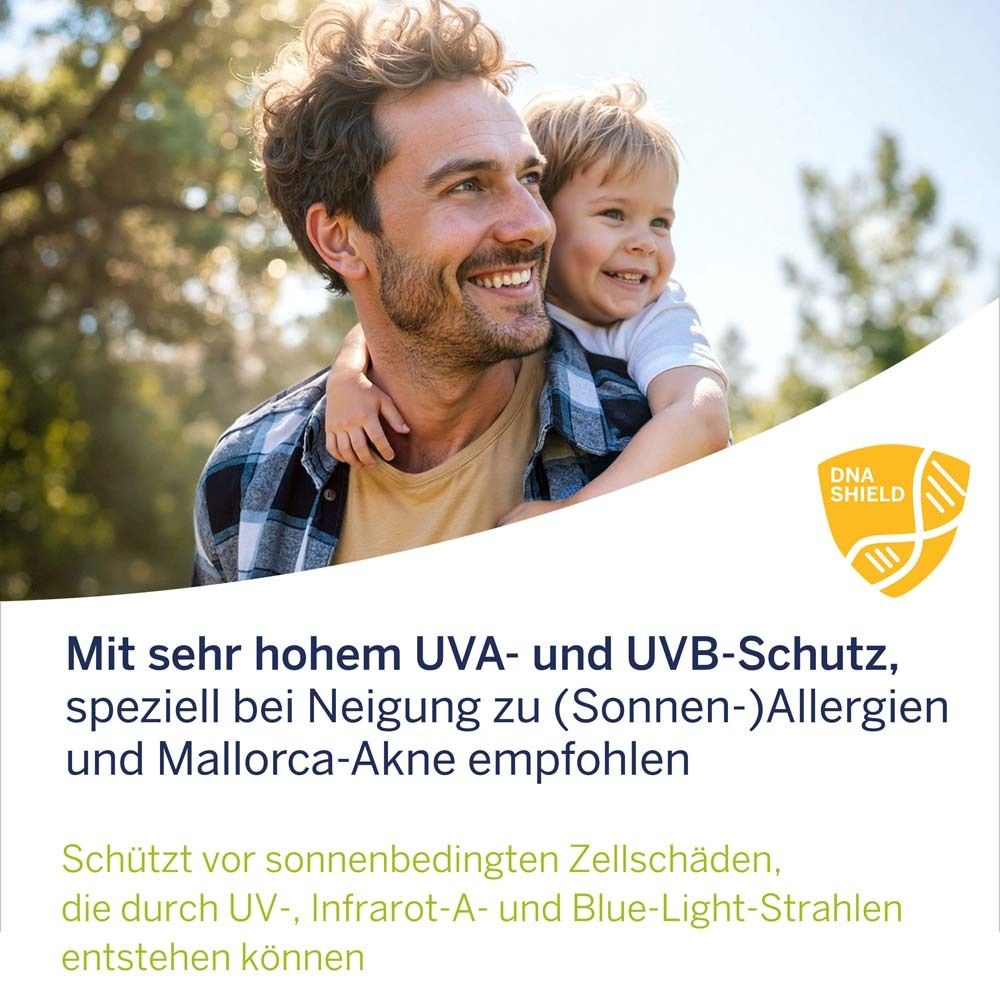 Mann und Kind im Freien. Text: Mit sehr hohem UVA- und UVB-Schutz, speziell bei Neigung zu (Sonnen-)Allergien und Mallorca-Akne empfohlen.