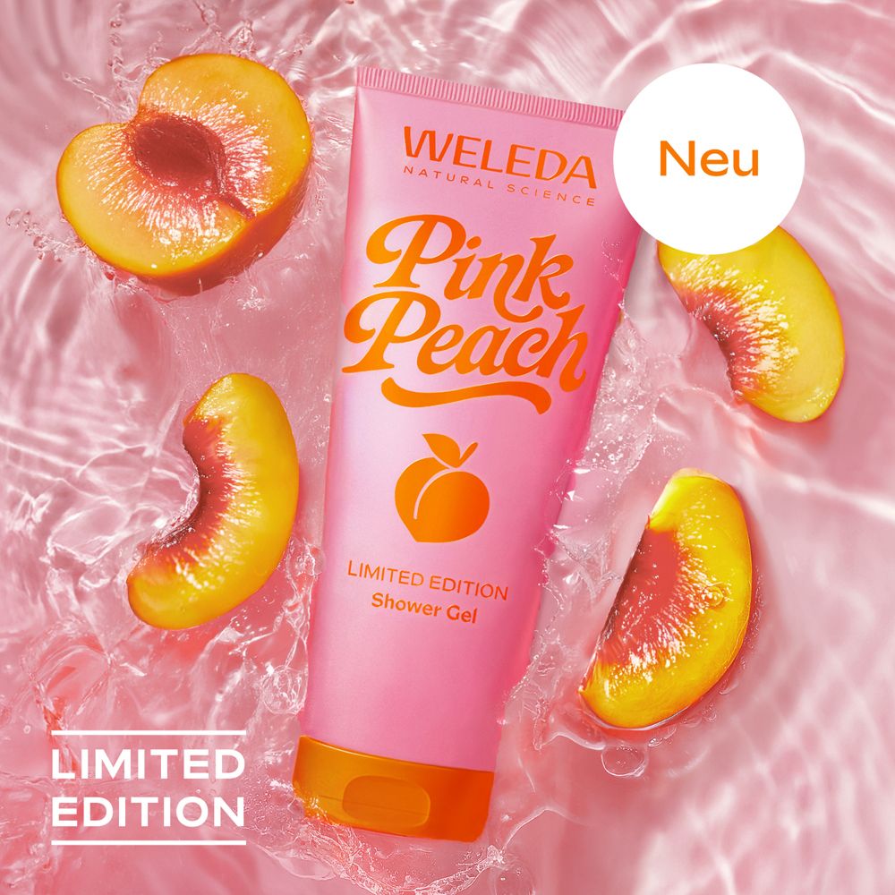 Rosa Tube mit Pfirsichen im Wasser. "WELEDA Pink Peach" und Pfirsich-Illustration. "Limited Edition" und "Neu".