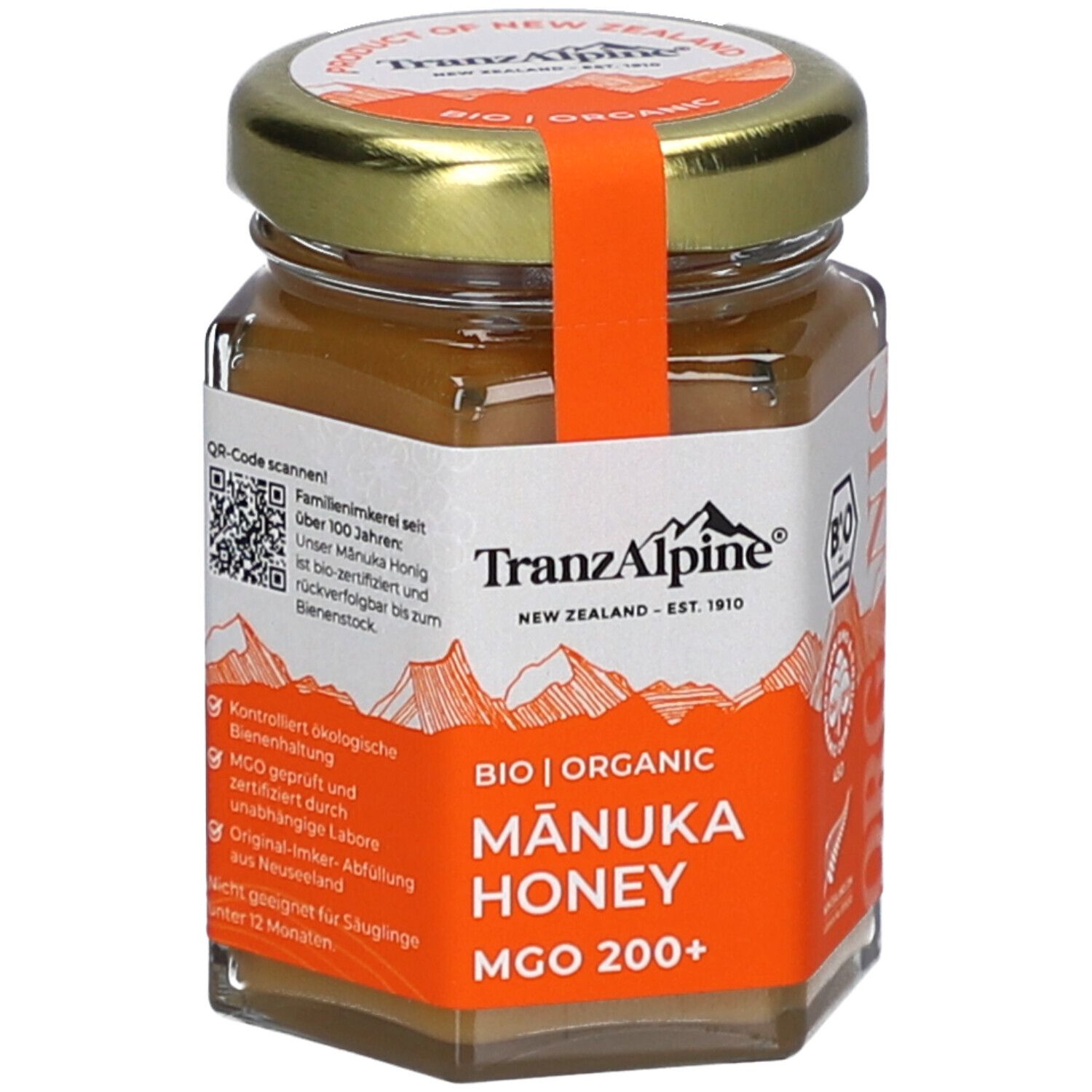 Glas mit BIO MANUKA Honig MGO 200+. Orangefarbenes Etikett mit Text und Logo. Deckel mit orangefarbenem Band.