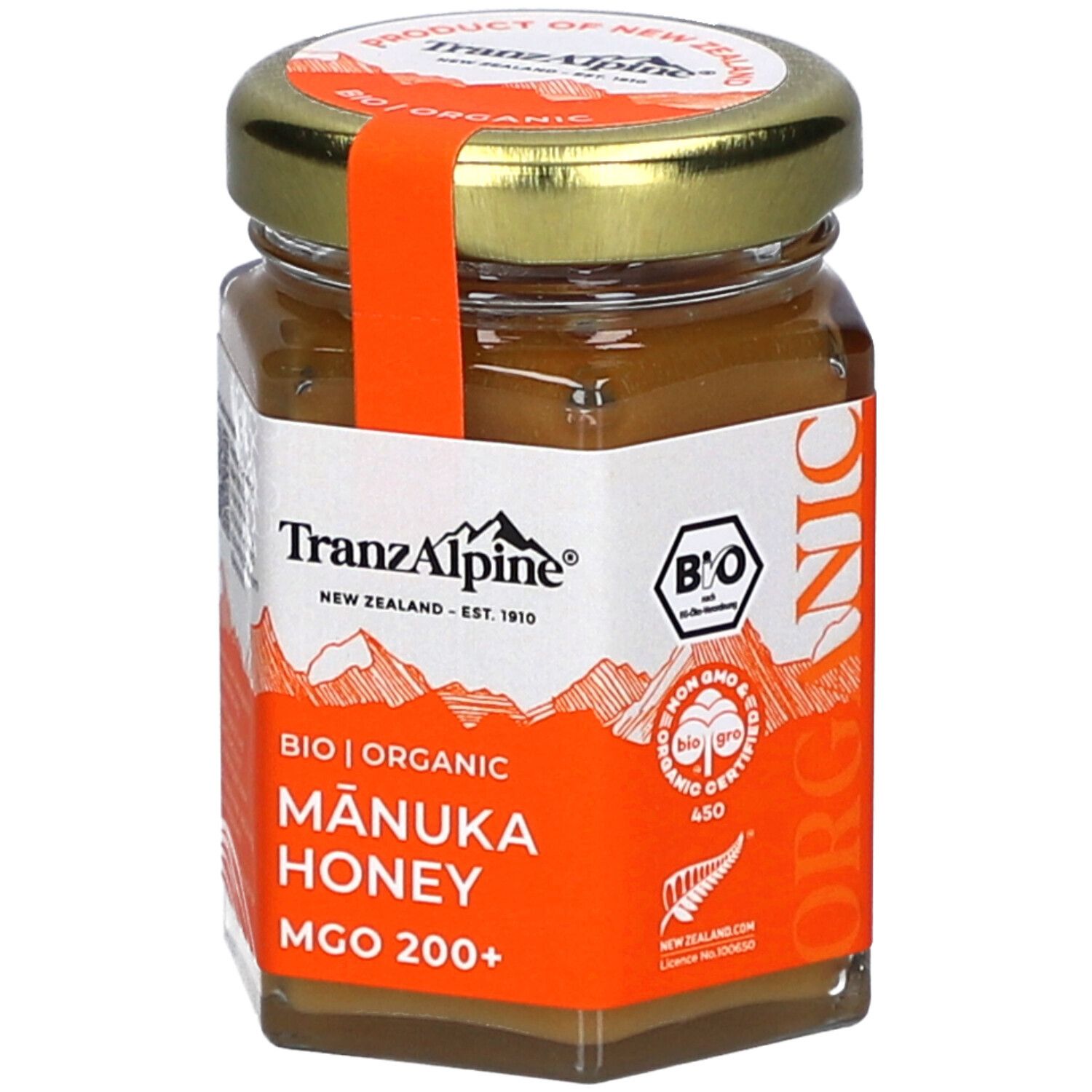 Glas mit BIO MANUKA Honig. Orangefarbenes Etikett mit Text und Logo. Zertifizierungen und Text.