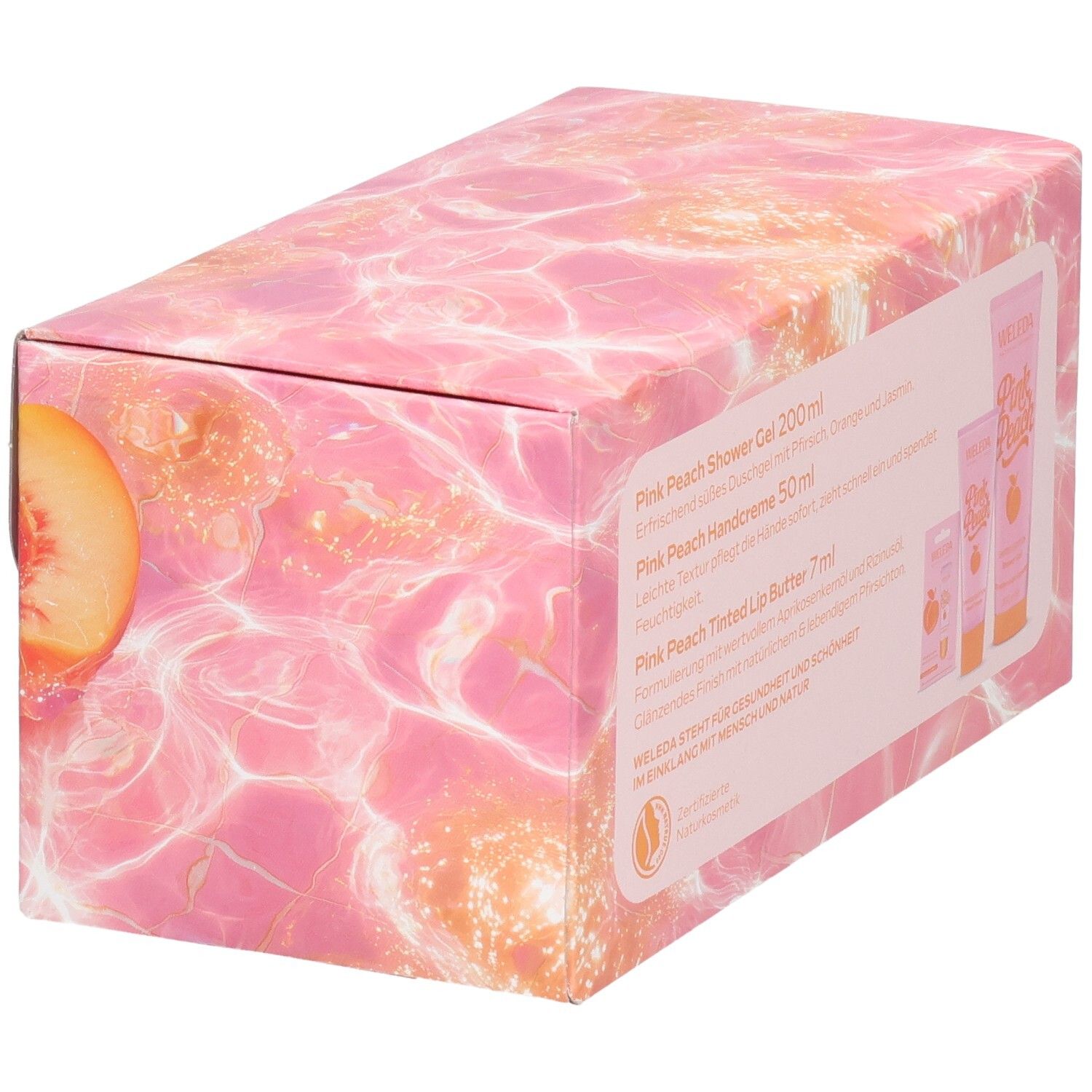 Geschenkset-Verpackung mit Pfirsich-Motiv. Enthält Duschgel, Handcreme und Lippenbutter. Weleda-Logo und Pink Peach.