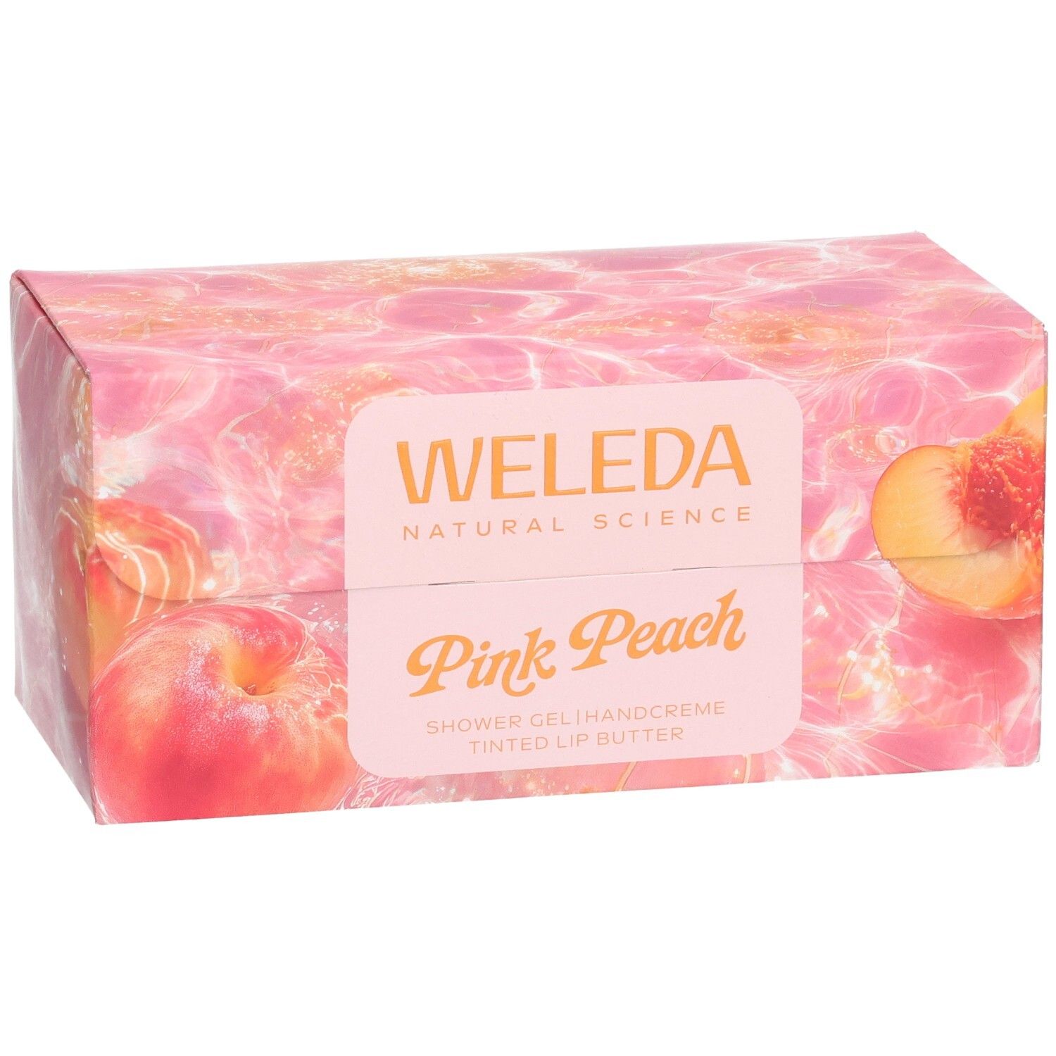 Geschenkset-Verpackung mit Pfirsich-Motiv. Aufschrift: Weleda, Pink Peach. Enthält Duschgel, Handcreme und Lippenbutter.