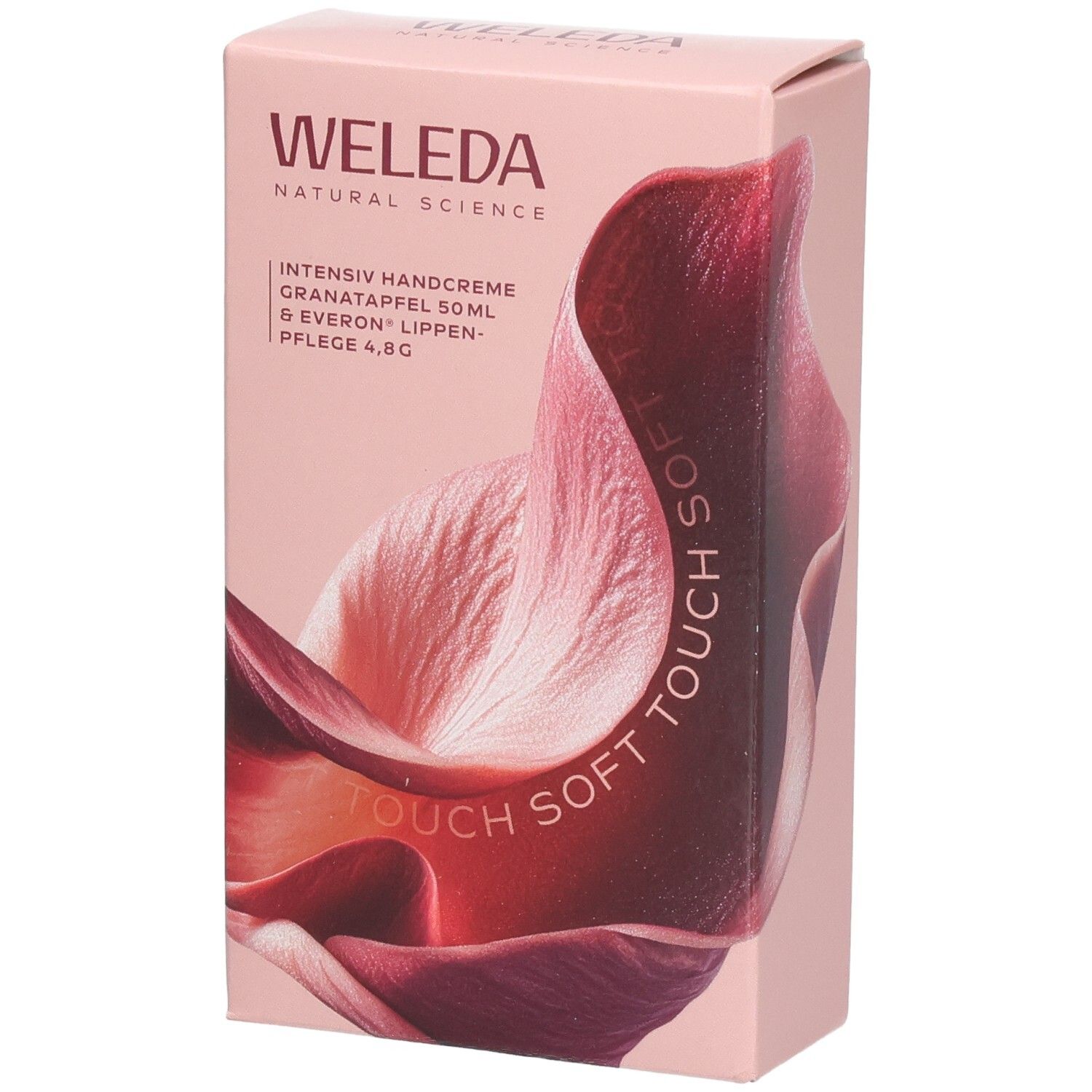 Rosa Geschenkbox mit WELEDA-Logo und floralem Design. Text: Intensiv Handcreme, Granatapfel, Lippenpflege.