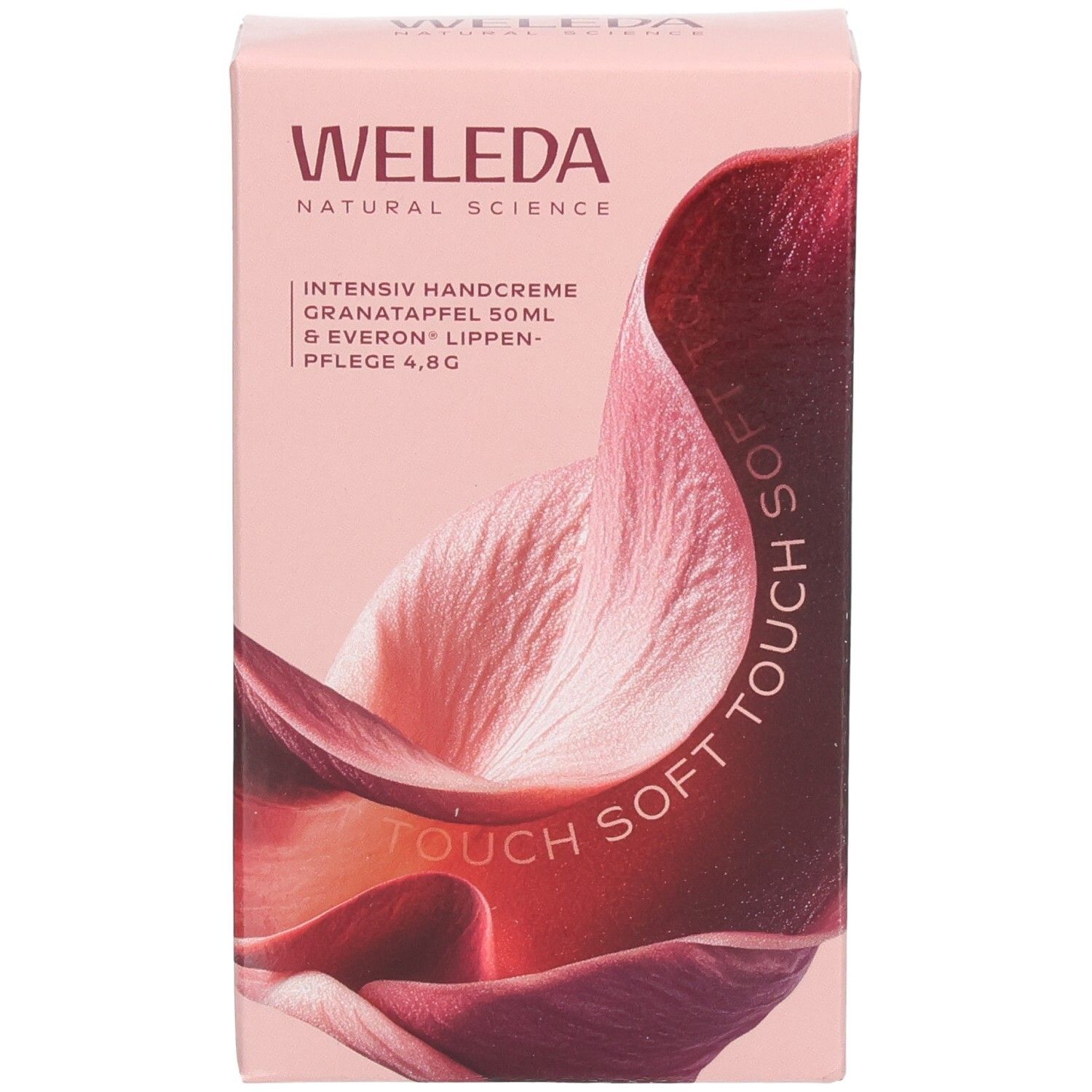 Rosa Geschenkbox mit WELEDA-Logo und floralem Design. Text: Intensiv Handcreme, Granatapfel, Lippenpflege.
