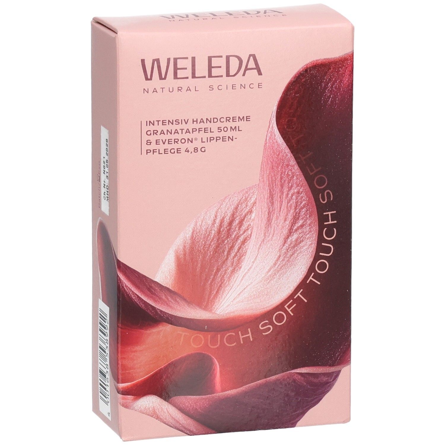 Rosa Geschenkbox mit WELEDA-Logo und floralem Design. Text: Intensiv Handcreme, Granatapfel, Lippenpflege.