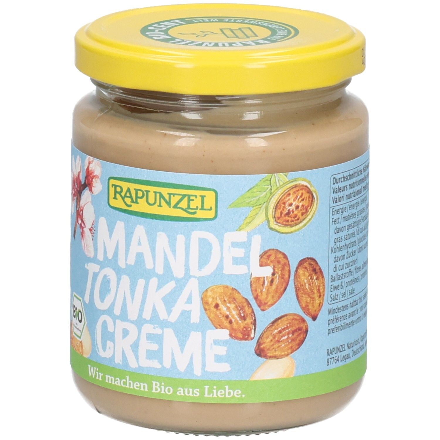 Rapunzel Mandel-Tonka-Creme im Glas, Fokus auf Mandeln und Blüten auf dem Etikett.