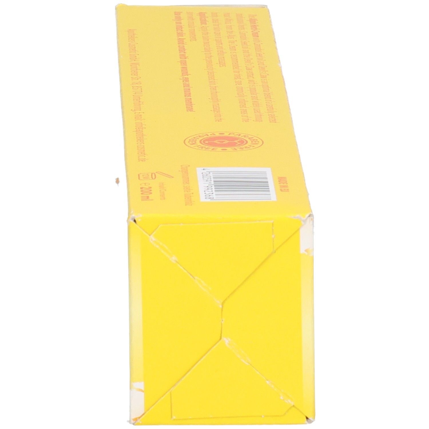 Gelber Karton mit Text und Barcode. 200 ml Angabe sichtbar.