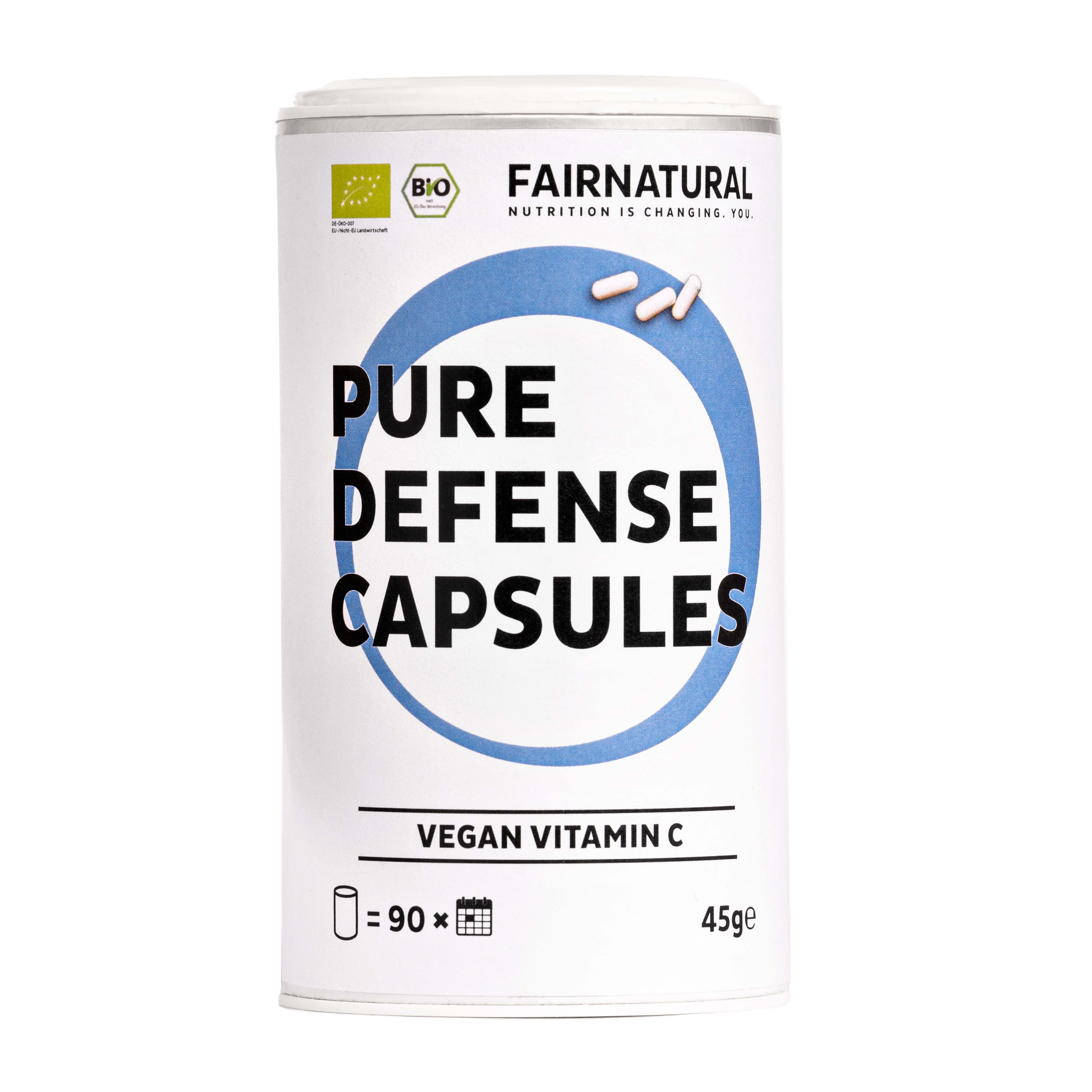 Weiße Dose mit blauer Grafik und Text. Enthält Kapseln. Aufschrift: Pure Defense Capsules, Vegan Vitamin C. Bio-Siegel.
