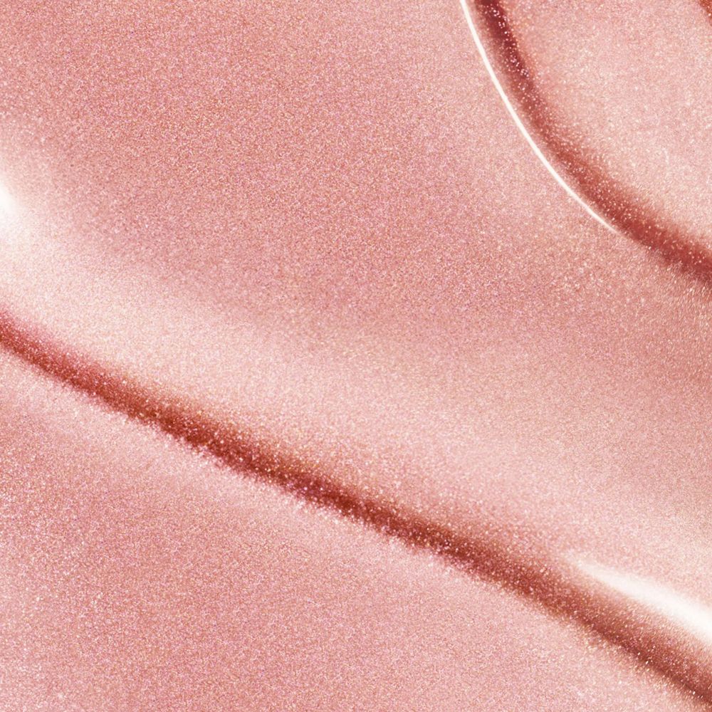 Nahaufnahme einer rosa, glänzenden Flüssigkeit. Wellenförmige Textur.