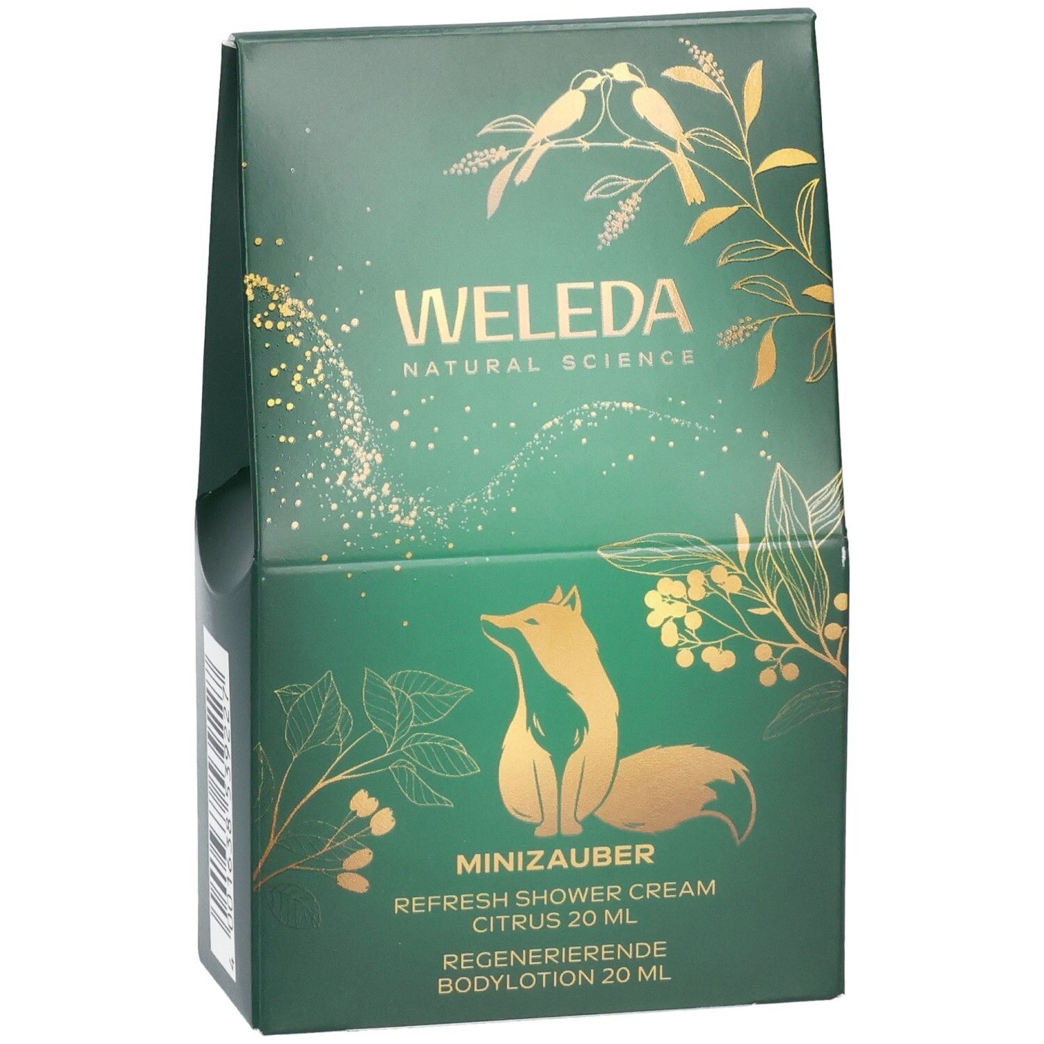 Grüne Geschenkverpackung von WELEDA mit Fuchs- und Pflanzenmotiven, enthält Duschcreme und Bodylotion.