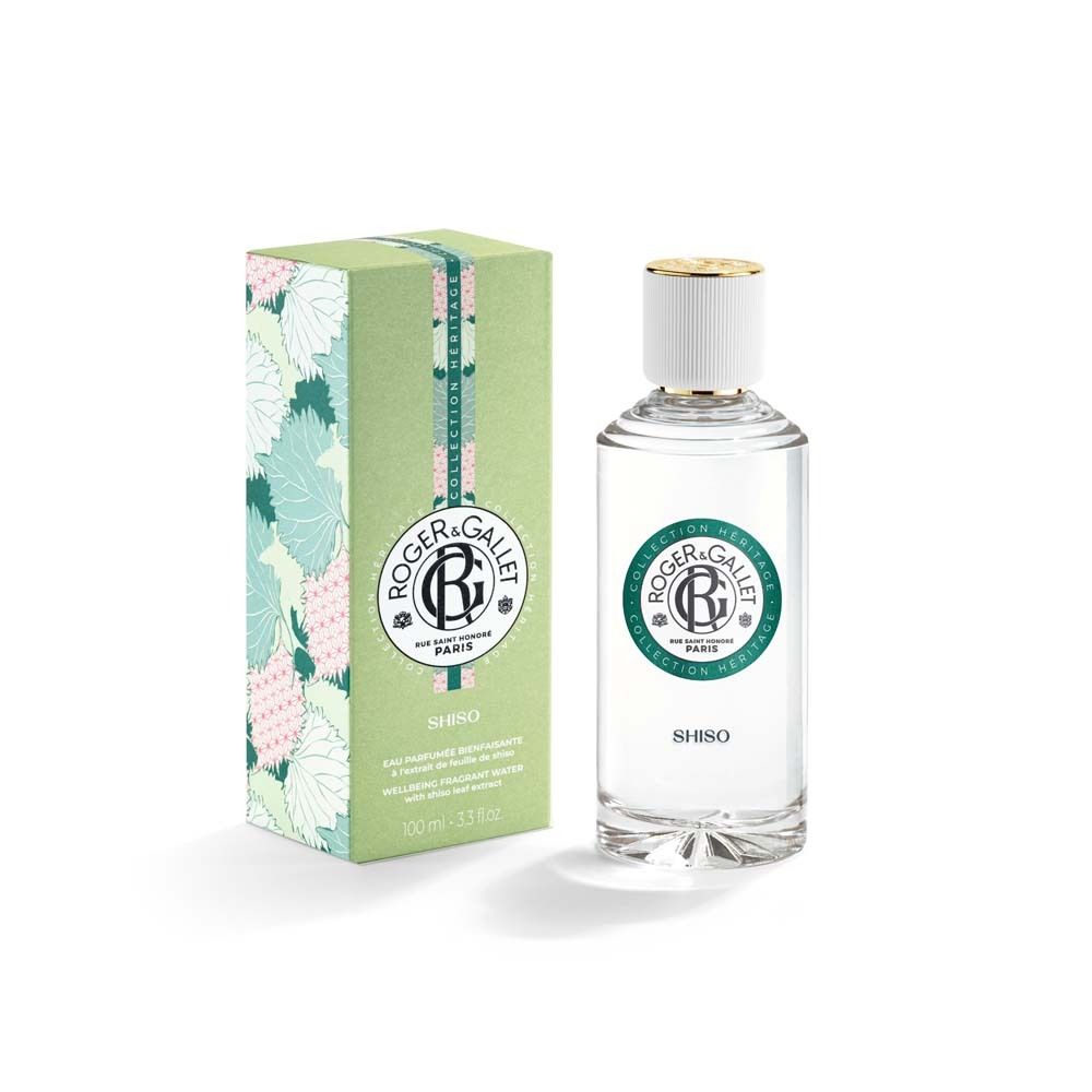 Produktflakon und Verpackung. Flakon mit weißem Deckel und grünem Etikett. Verpackung grün mit floralem Muster.