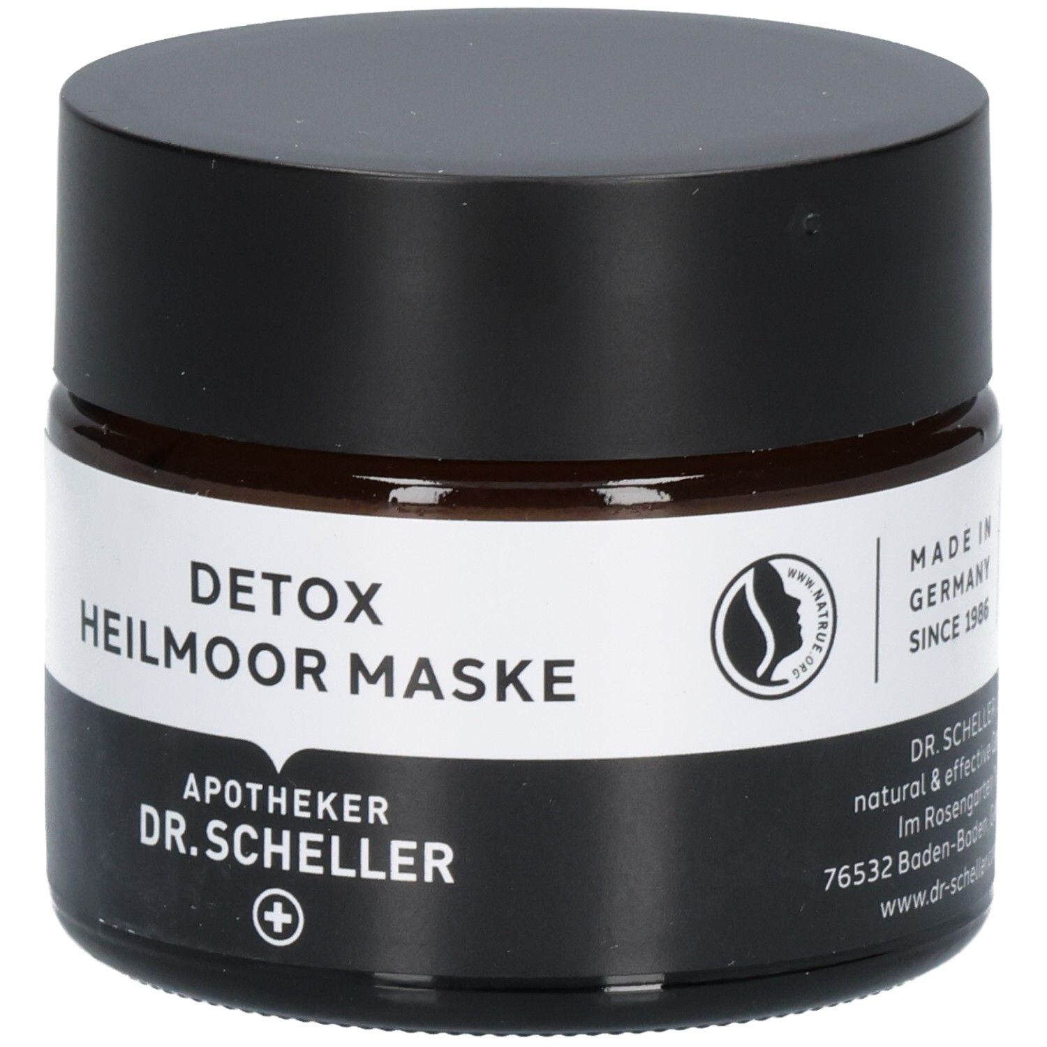 Dunkles Glasgefäß mit schwarzem Deckel, Etikett mit "DETOX HEILMOOR MASKE" und "DR. SCHELLER".