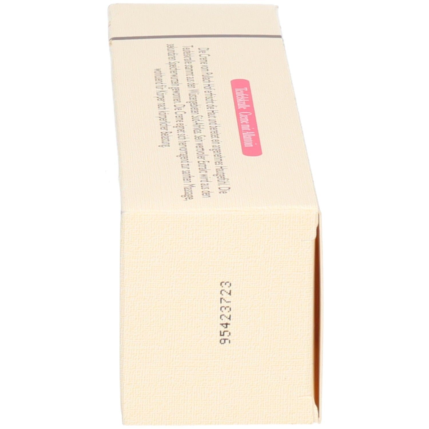 Beige Kartonverpackung mit Text und rosa Etikett.