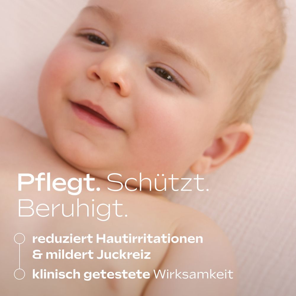 Nahaufnahme Babygesicht, mit Text "Pflegt. Schützt. Beruhigt." und "klinisch getestete Wirksamkeit".