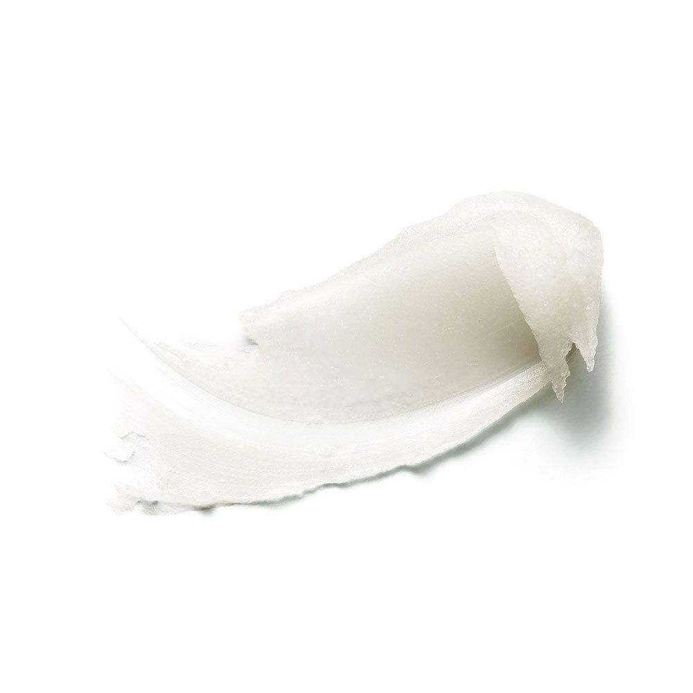 Échantillon de crème blanche. Texture visible.