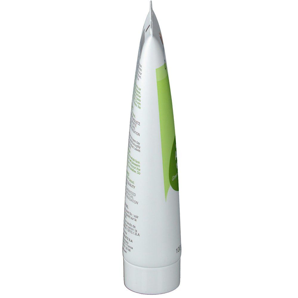 Vue latérale d'un tube blanc. Inscription : Argiletz. Contient de l'argile verte. Pointu en haut, avec bouchon à vis.