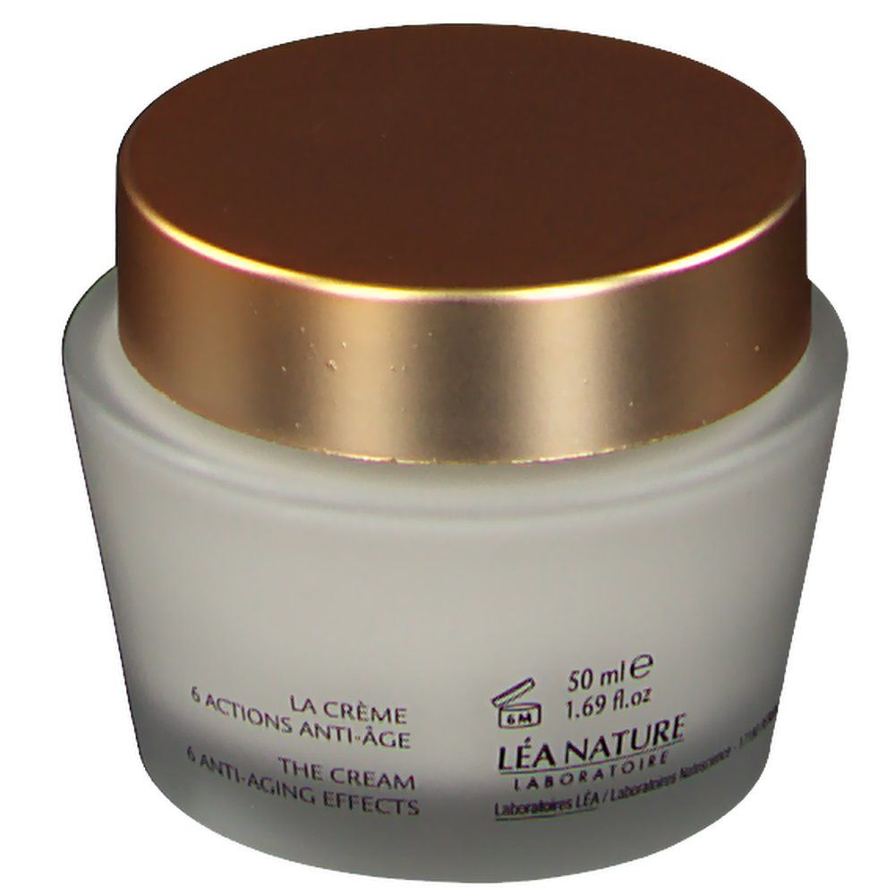 Pot en verre avec couvercle doré. Inscription: 6 actions anti-âge, The Cream, 6 anti-aging effects, 50 ml. Logo et texte.
