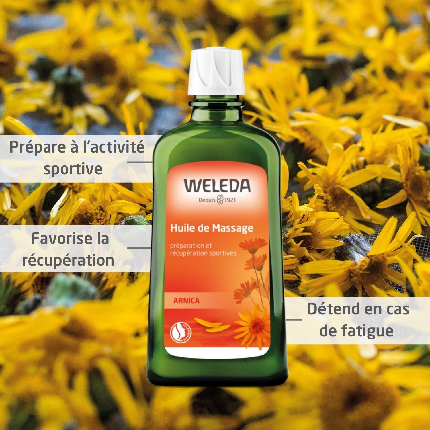 Grüne Flasche mit weißem Verschluss, umgeben von gelben Blüten. Produktetikett mit Text. Text: 'Huile de Massage'.