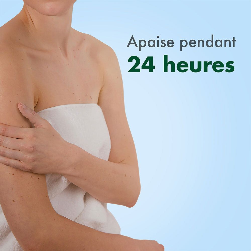 Femme avec une serviette. Texte: Apaise pendant 24 heures. Fond bleu.