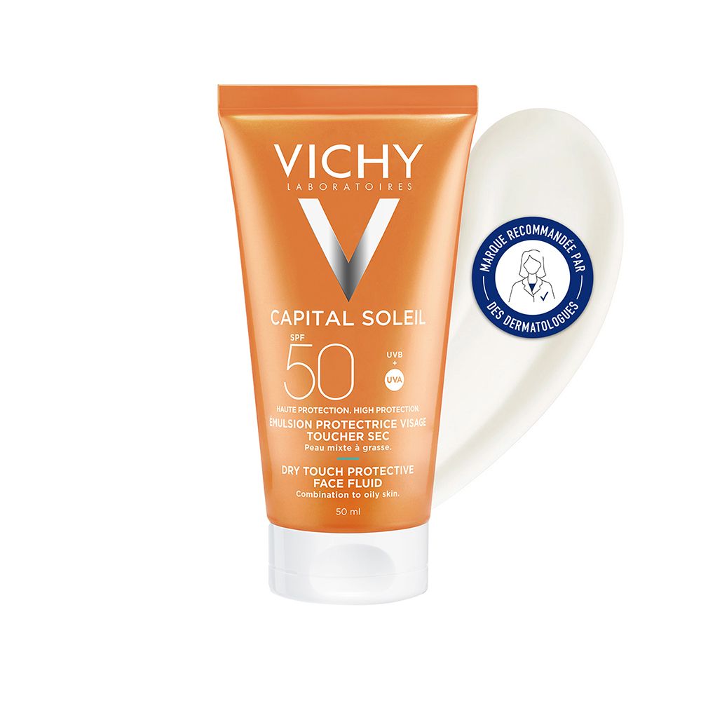 Tube Vichy Capital Soleil SPF 50, orange et blanc. Inscription: Dry Touch. Avec logo dermatologues.