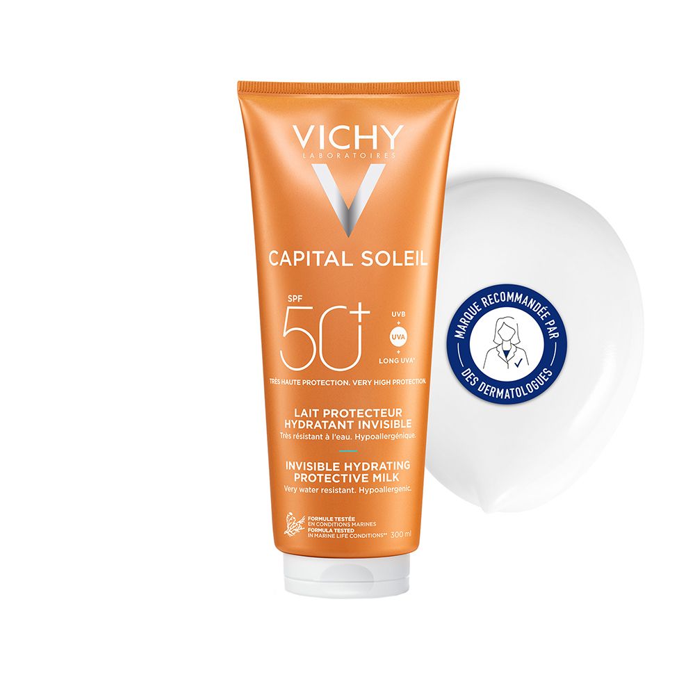 Tube orange avec bouchon blanc. Inscription: Vichy, Capital Soleil, SPF 50+, Lait Protecteur Hydratant Invisible. Sceau: Marque Recommandée par des Dermatologues.