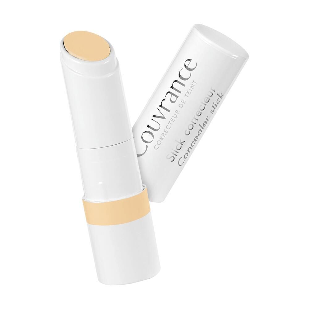 Gele concealerstick, witte stick met geel product. Dop ernaast.