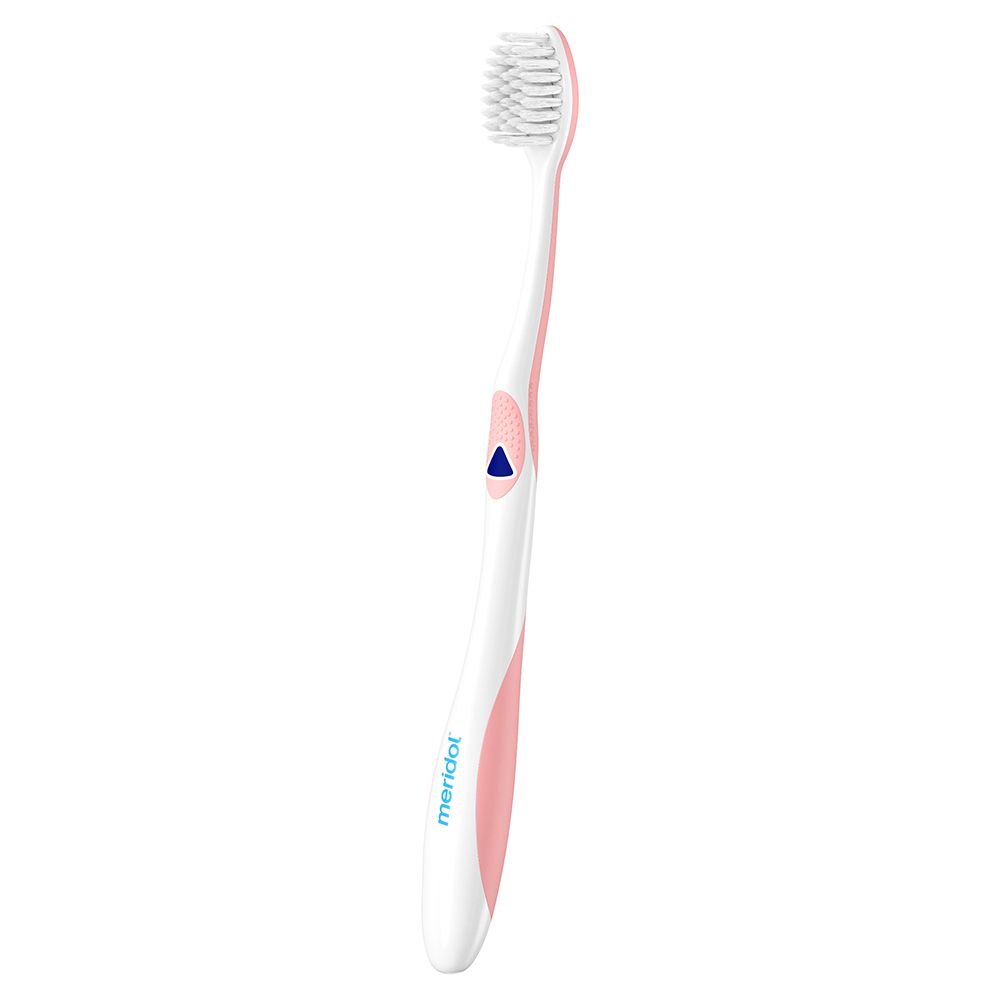 Brosse à dents avec tête blanche et manche blanc avec accents roses. Marque : meridol.