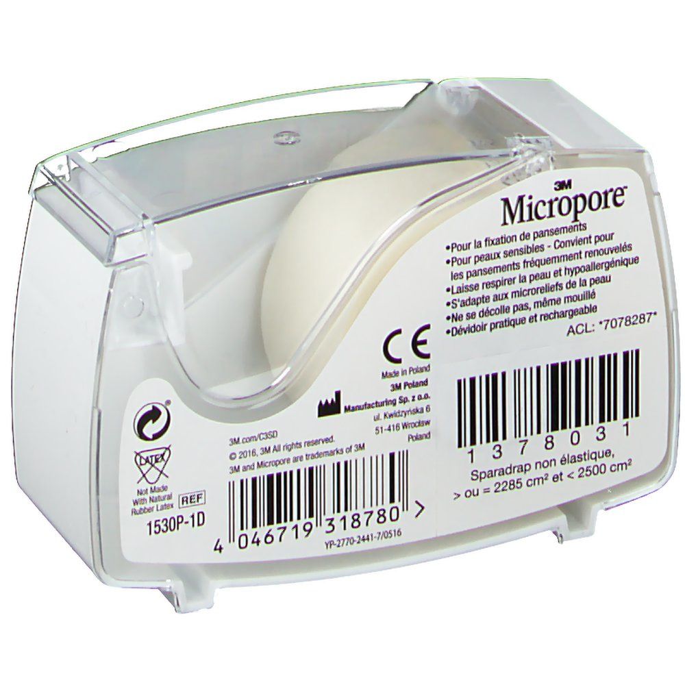 Distributeur blanc de ruban adhésif 3M Micropore. Inscriptions : Micropore, marquage CE, code-barres. Partie supérieure transparente.
