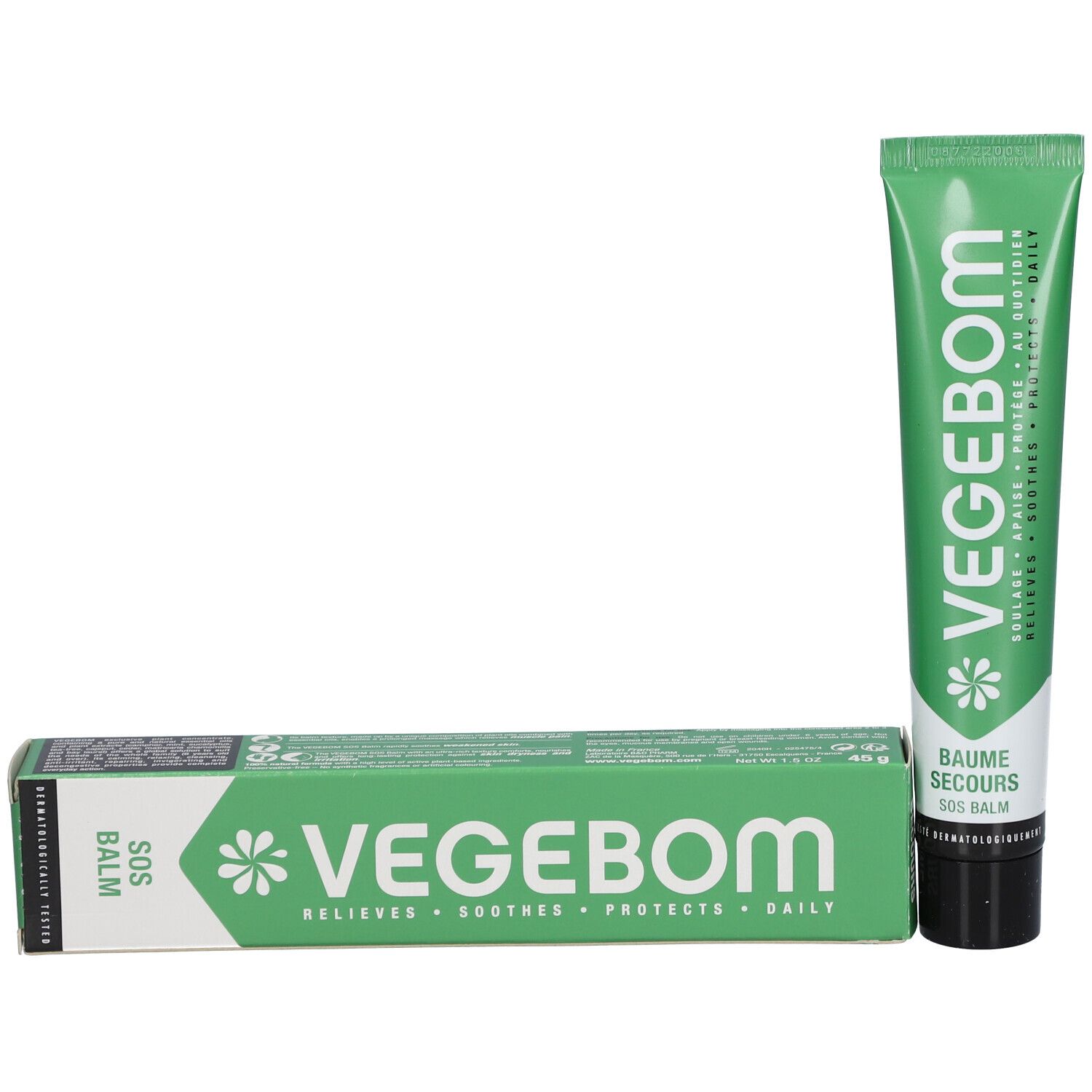 Boîte et tube verts. Inscription: VEGEBOM, BAUME SECOURS SOS BALM. Tube avec bouchon noir.