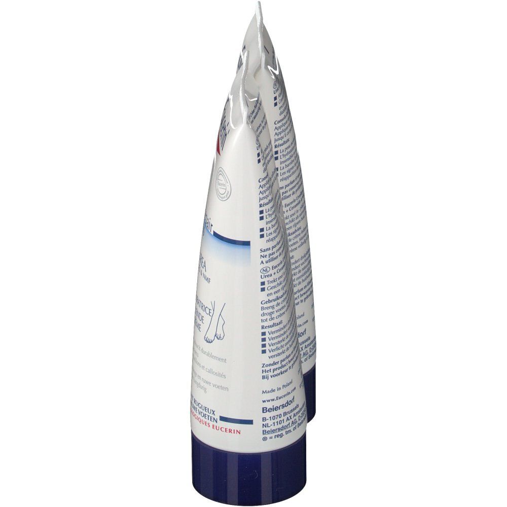 Deux tubes de crème, vue latérale. Blanc, avec des accents bleus et rouges. Inscription partiellement visible.