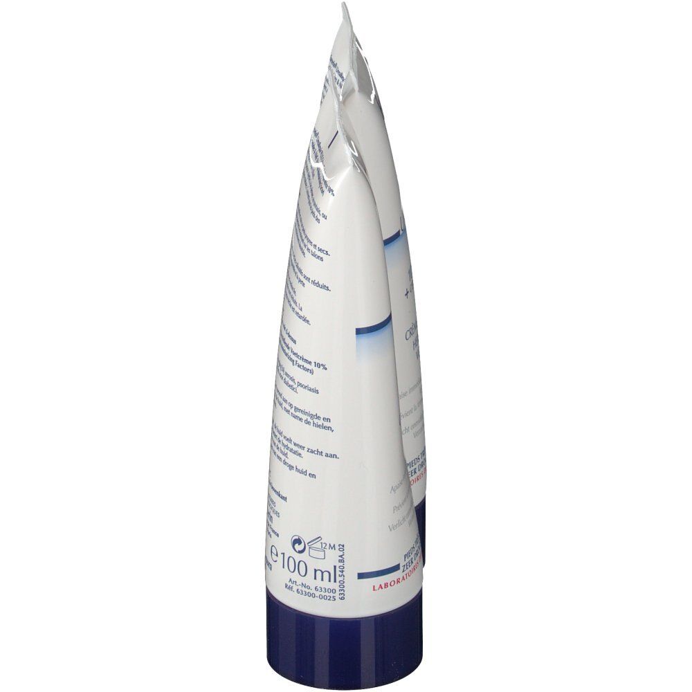 Deux tubes de crème, vue latérale. Texte et bouchon bleu visibles. Fond blanc.