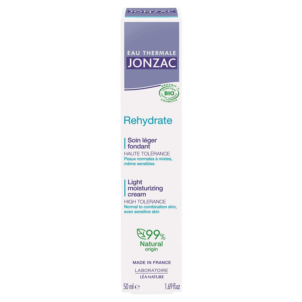 Emballage produit : tube et carton blancs. Tous deux avec des accents violets et des informations sur le produit. Contient « Jonzac » et « Rehydrate ».
