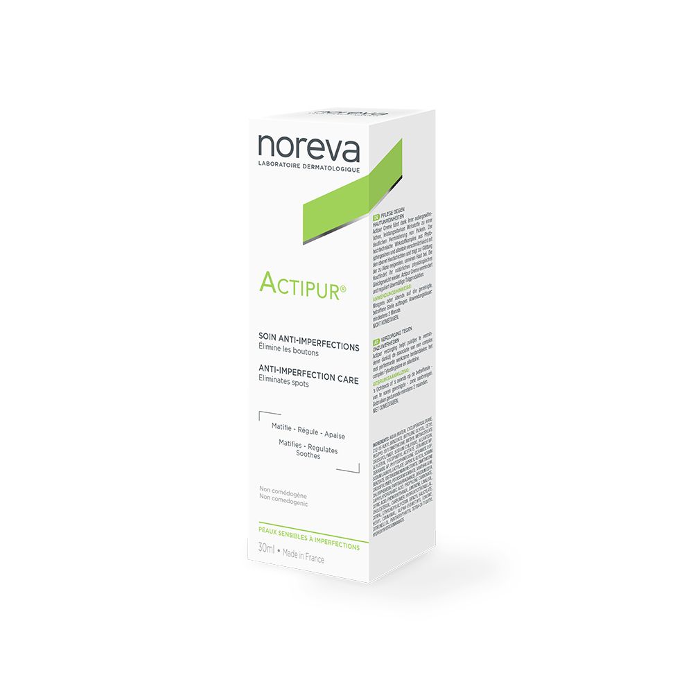 Kartonverpackung. Aufschrift: Noreva, Actipur, Anti-Imperfektions-Creme. Text in Deutsch. Grün-weiße Farbgebung.