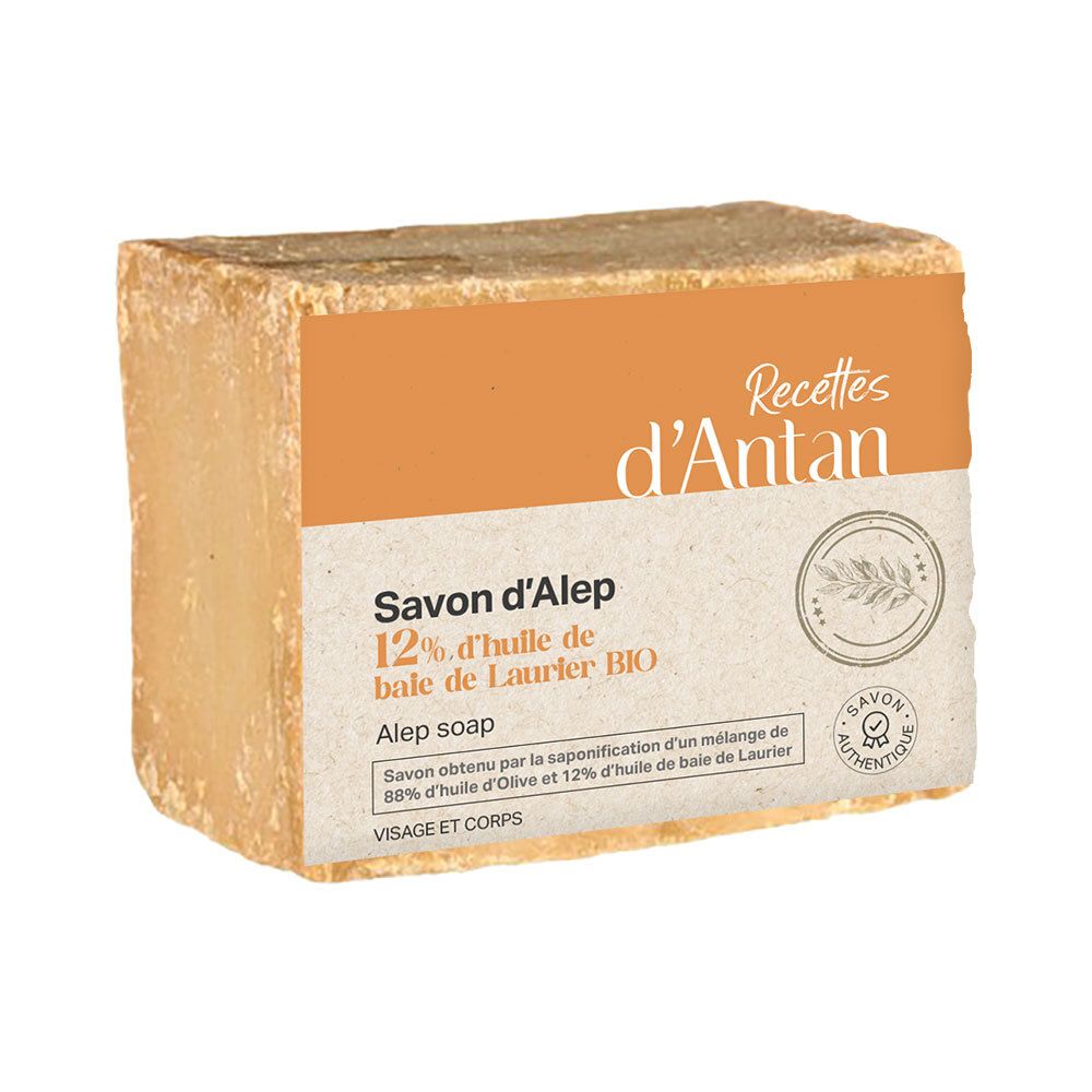 Aleppo-Seife mit 12% Lorbeeröl. Rechteckige Form, Papieretikett mit Produktinformationen und Logo.