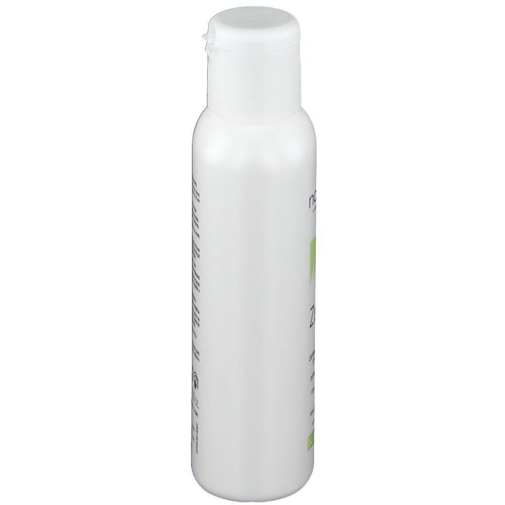 Witte fles met klapdeksel. Opschrift onleesbaar.