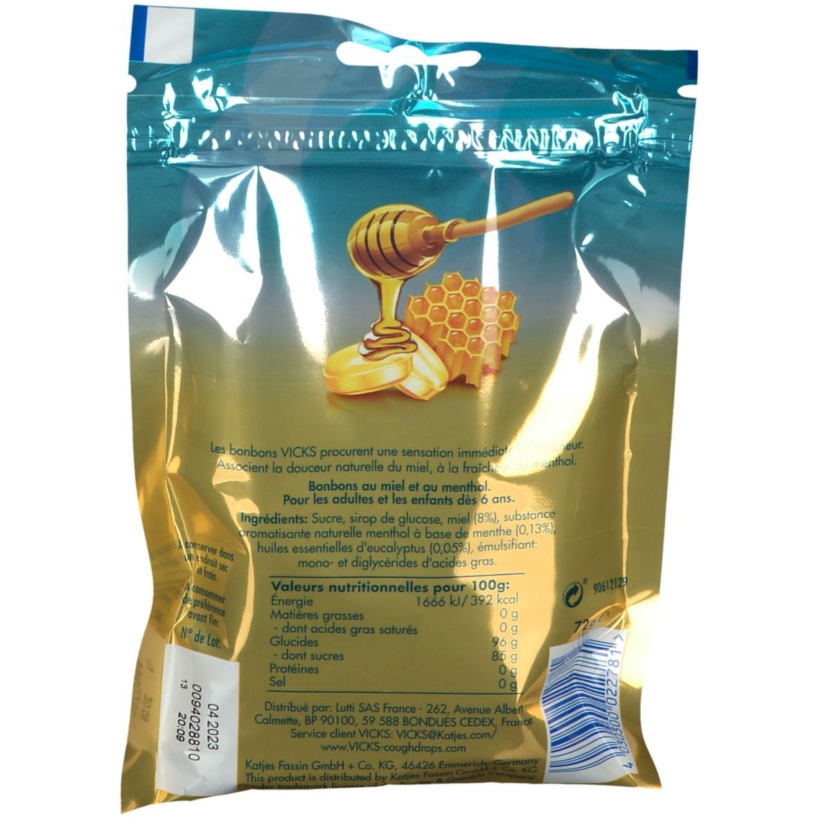 Rückseite der Vicks Honig Bonbons-Verpackung. Text mit Nährwertangaben und Zutaten. Abbildung von Honigwabe und Löffel.