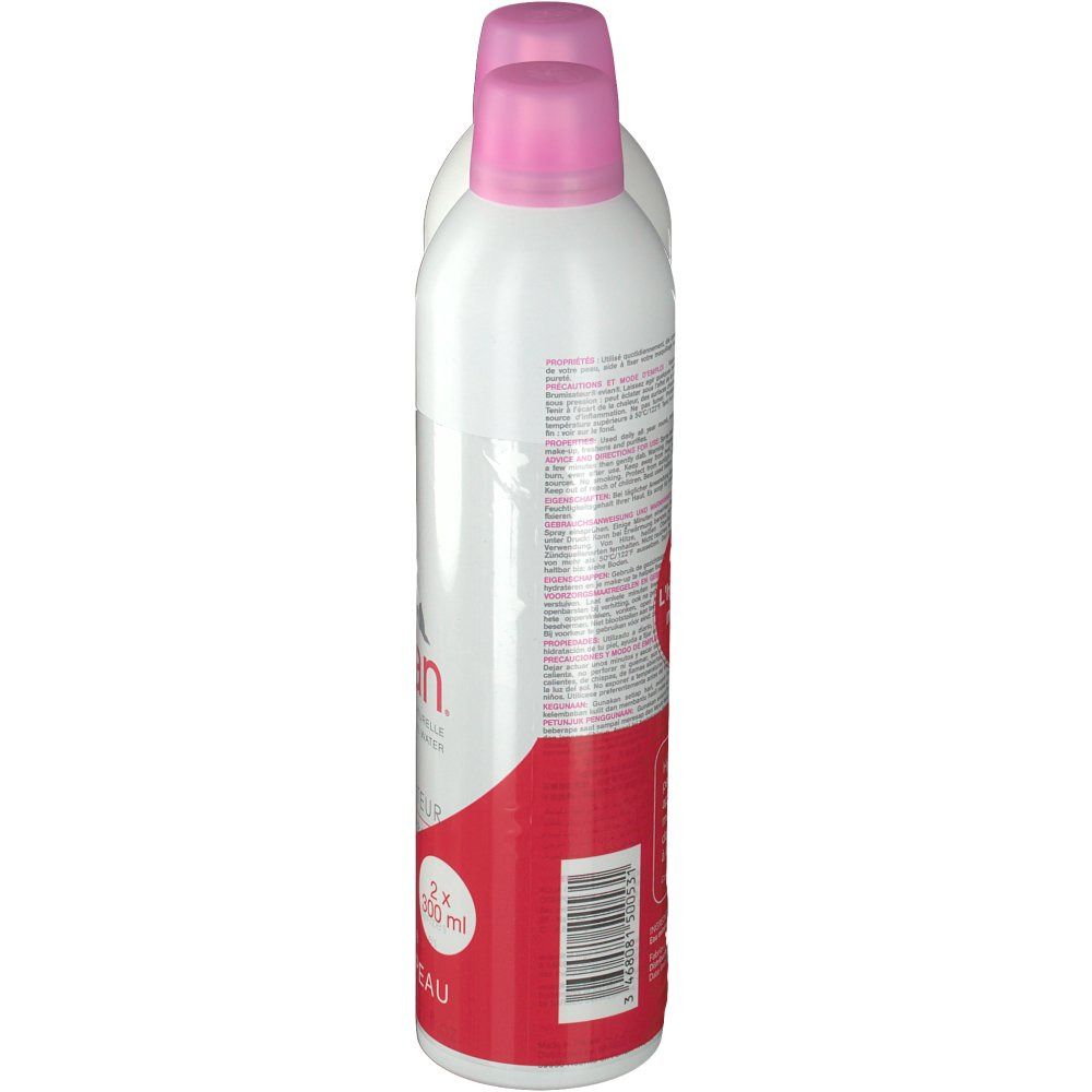 Deux sprays blancs avec bouchons roses, vue latérale. Emballage rouge avec texte et code-barres. Inscription: evian.