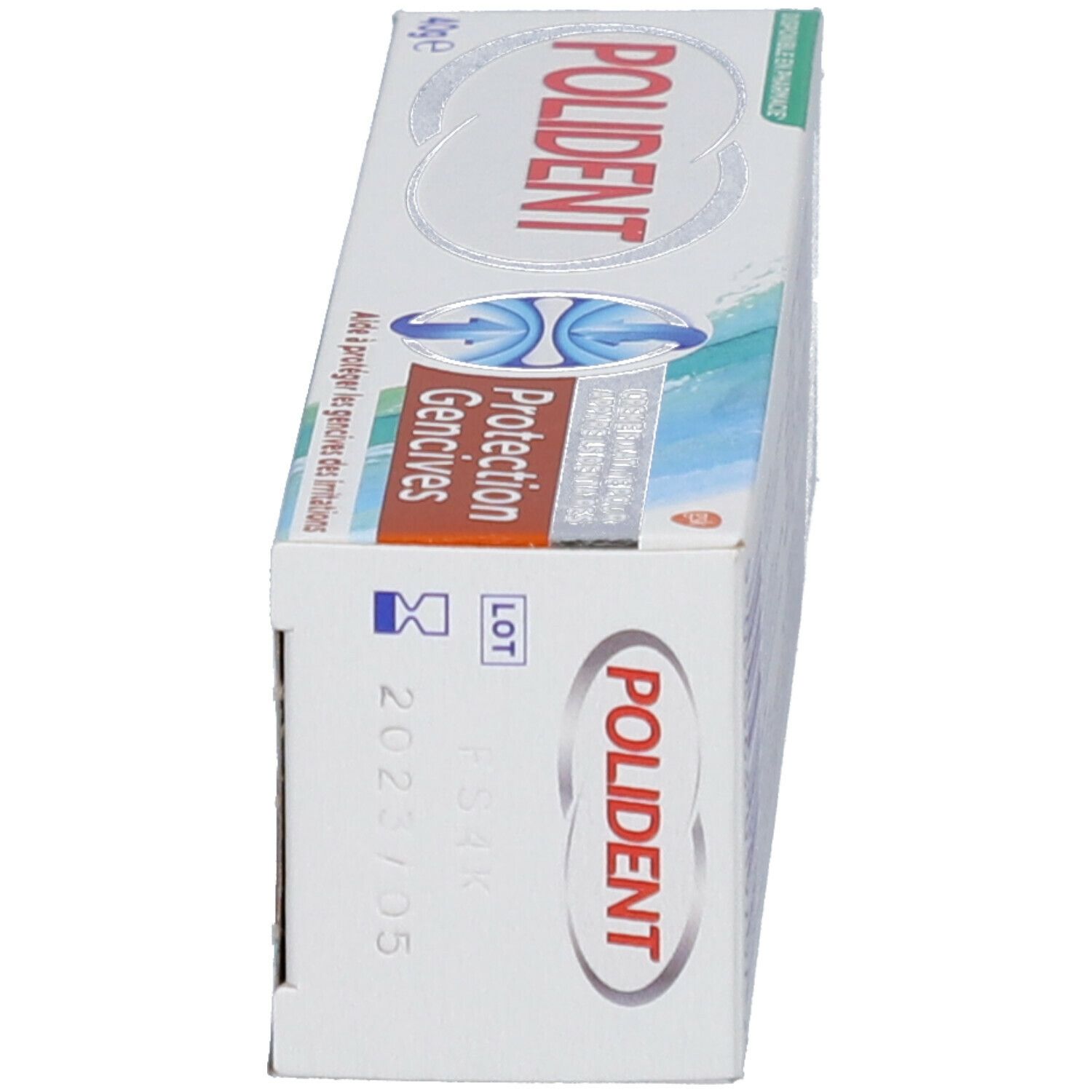 Emballage Polident. Côté. Texte: Protection Gencives, 40g e, numéro de lot, date de péremption 2023/05.