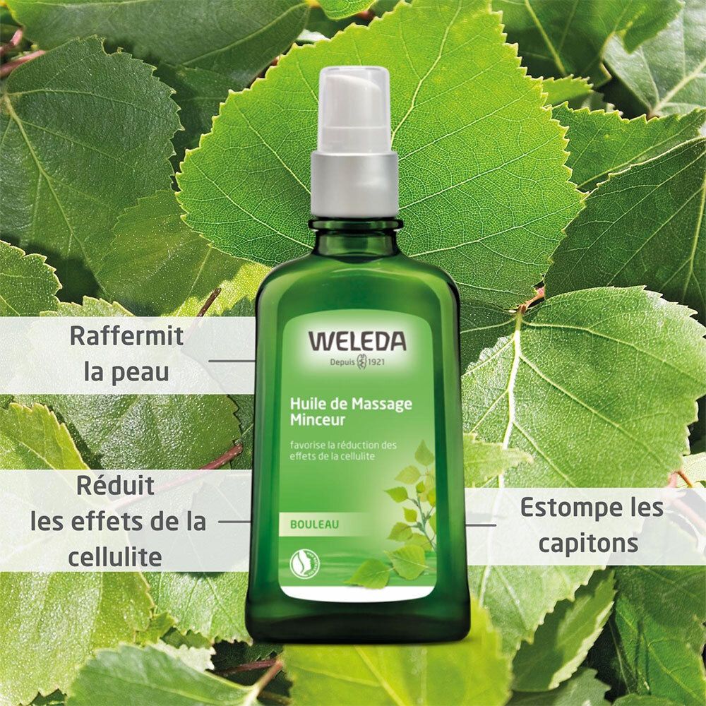 Flacon en verre vert avec pompe, entouré de feuilles de bouleau. Nom du produit et texte sur l'étiquette.