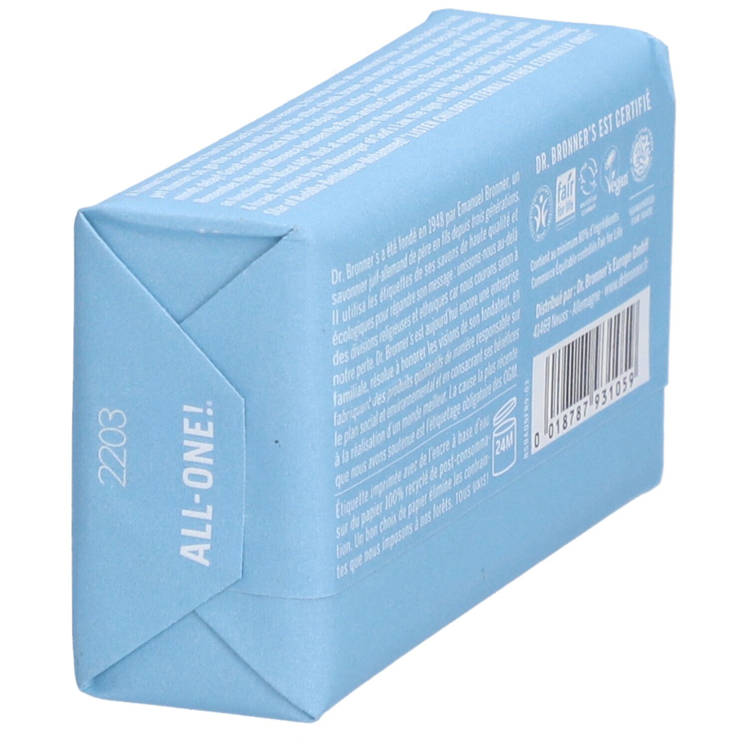 Savon emballé en bleu clair. Inscription : DR. BRONNER'S, ALL-ONE. Verso avec texte et code-barres. Label Fair Trade.