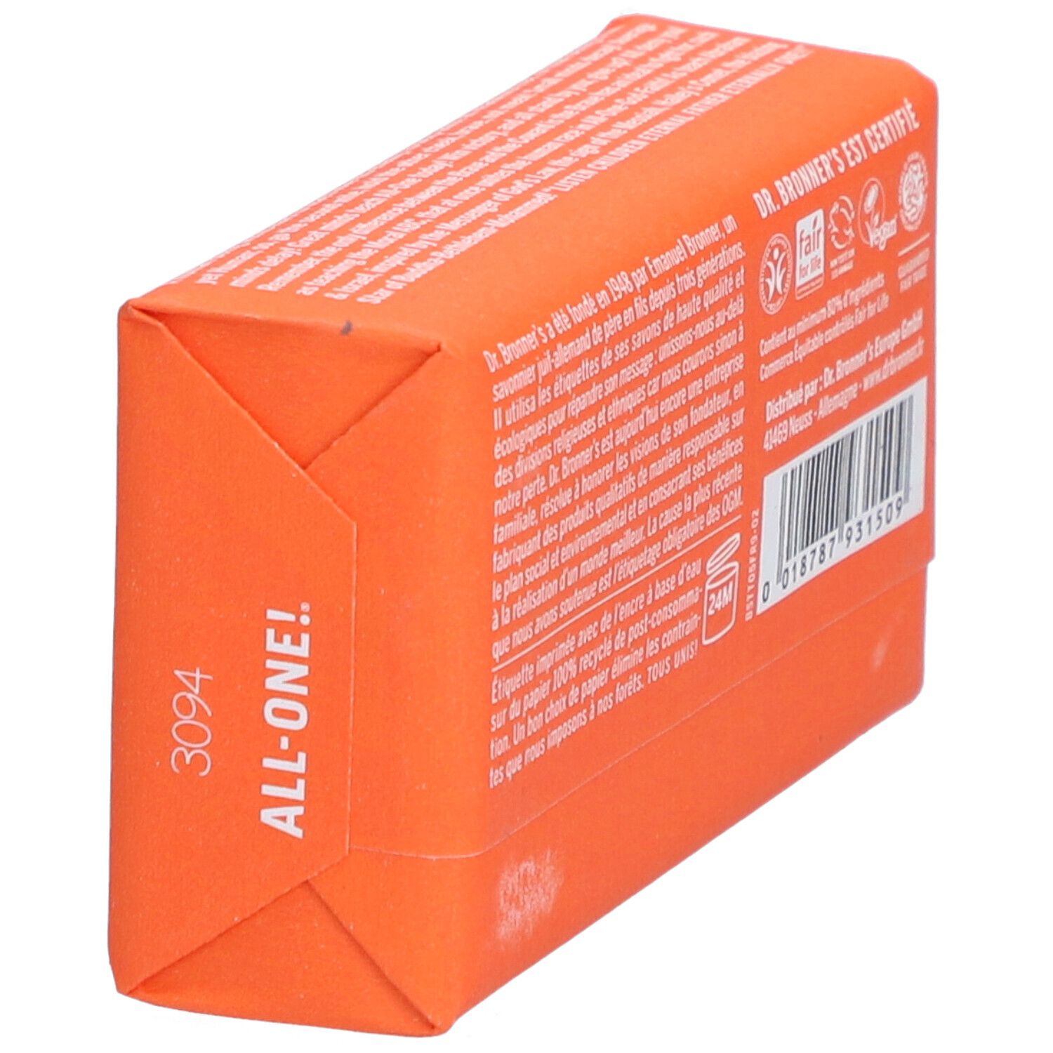 Savon emballé en papier orange. Inscriptions: DR. BRONNER'S. Vue latérale avec texte.
