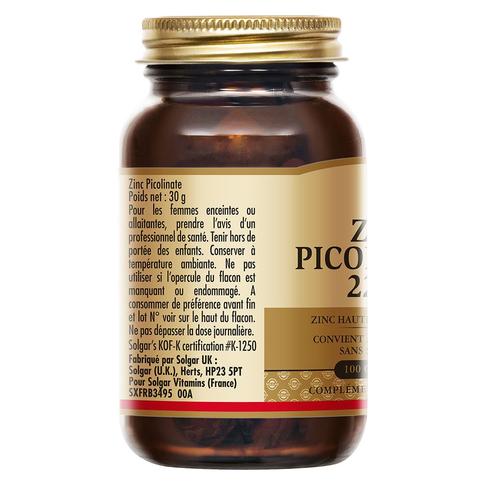 Dos du flacon en verre brun avec couvercle doré. Étiquette avec informations produit et avertissements.