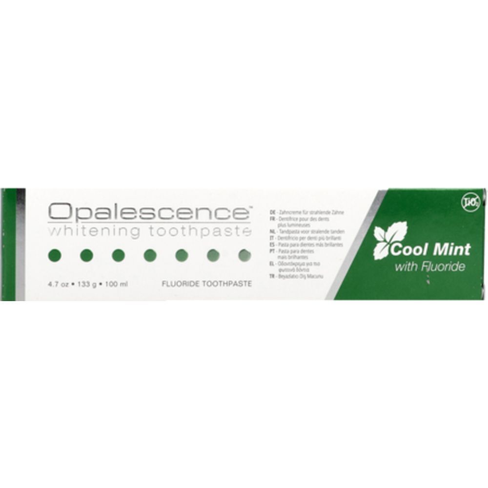 Tube et emballage de dentifrice. Blanc et vert. Inscription : Opalescence, Cool Mint, Fluorure.