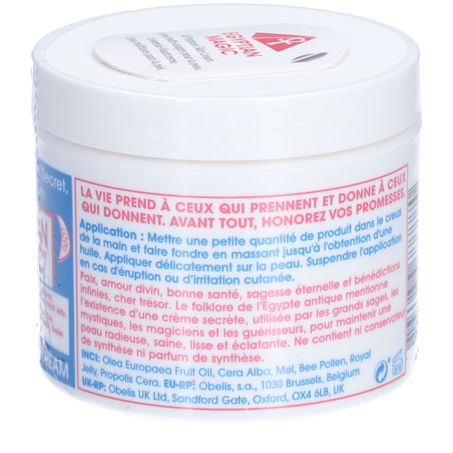 Pot blanc avec texte sur étiquette bleue et rouge. Texte : EGYPTIAN MAGIC. Instructions d'utilisation et ingrédients.
