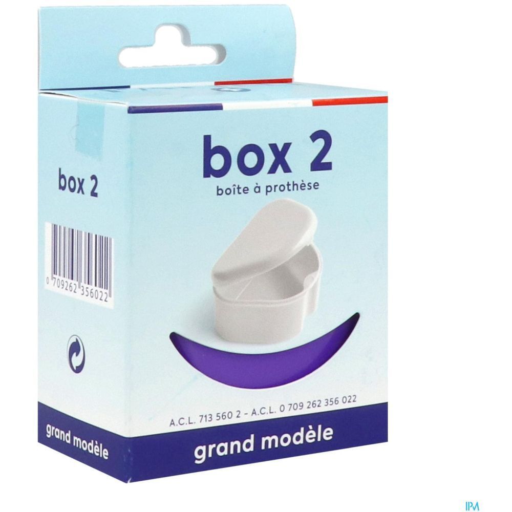 Boîte Box 2, grand modèle, dans emballage. Inscriptions : "box 2", "boîte à prothèse", "grand modèle". Boîte blanche avec couvercle.