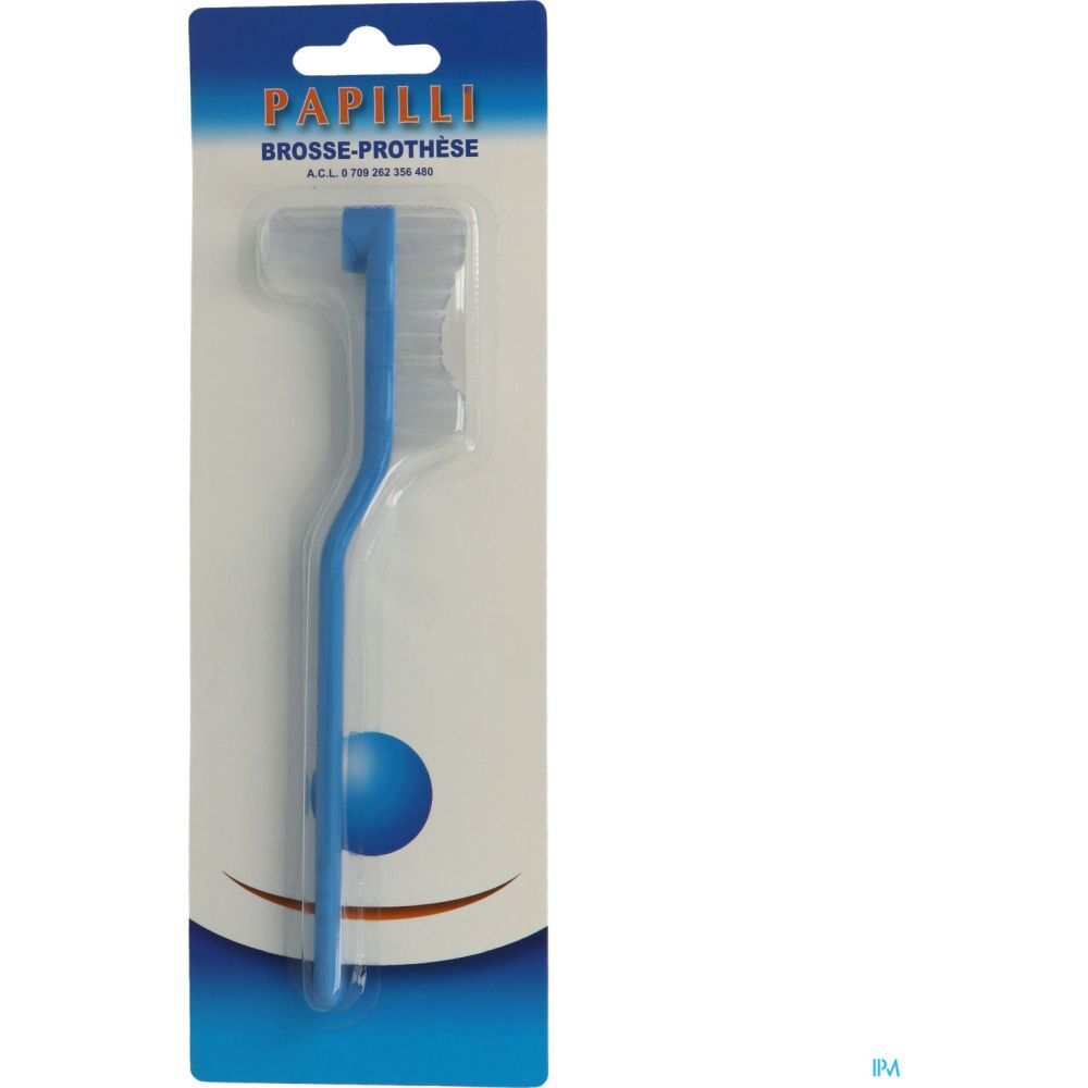 Brosse pour prothèse bleue, emballée. Manche courbé. Inscription "Papilli Brosse-Prothèse" sur l'emballage.