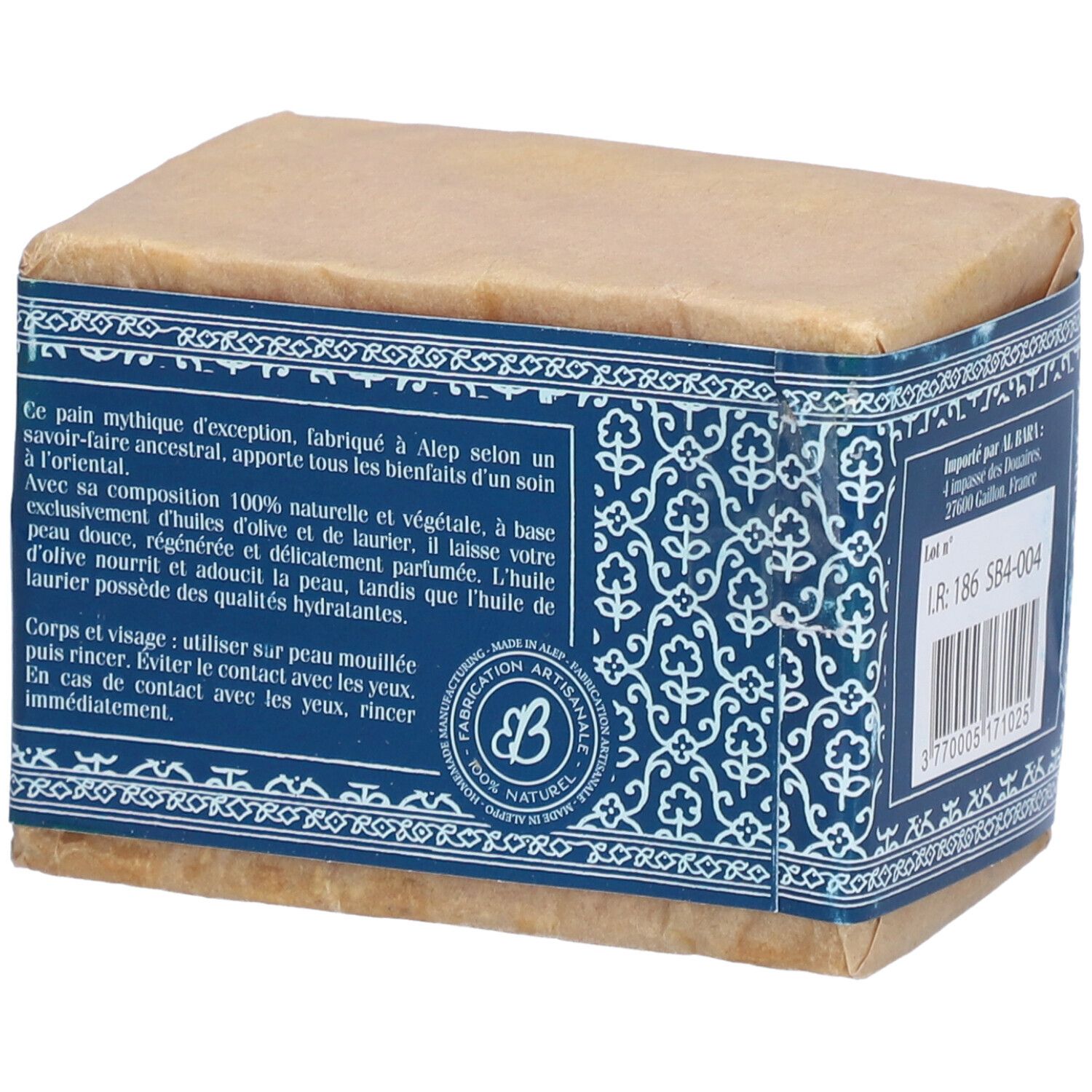 Savon emballé. Bande bleue avec motifs floraux et texte. Fabriqué à Alep, Syrie. 100% naturel.